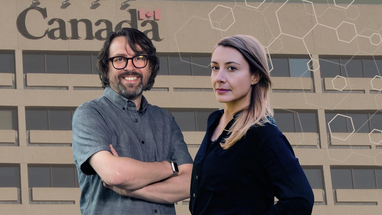 Professors Jason Millar and Kelly Bronson with Government of Canada building in the background.