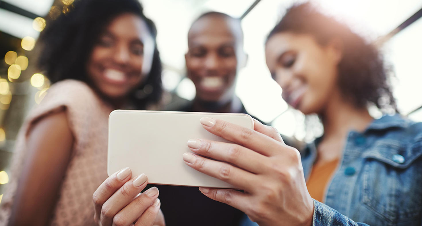three people taking a selfie