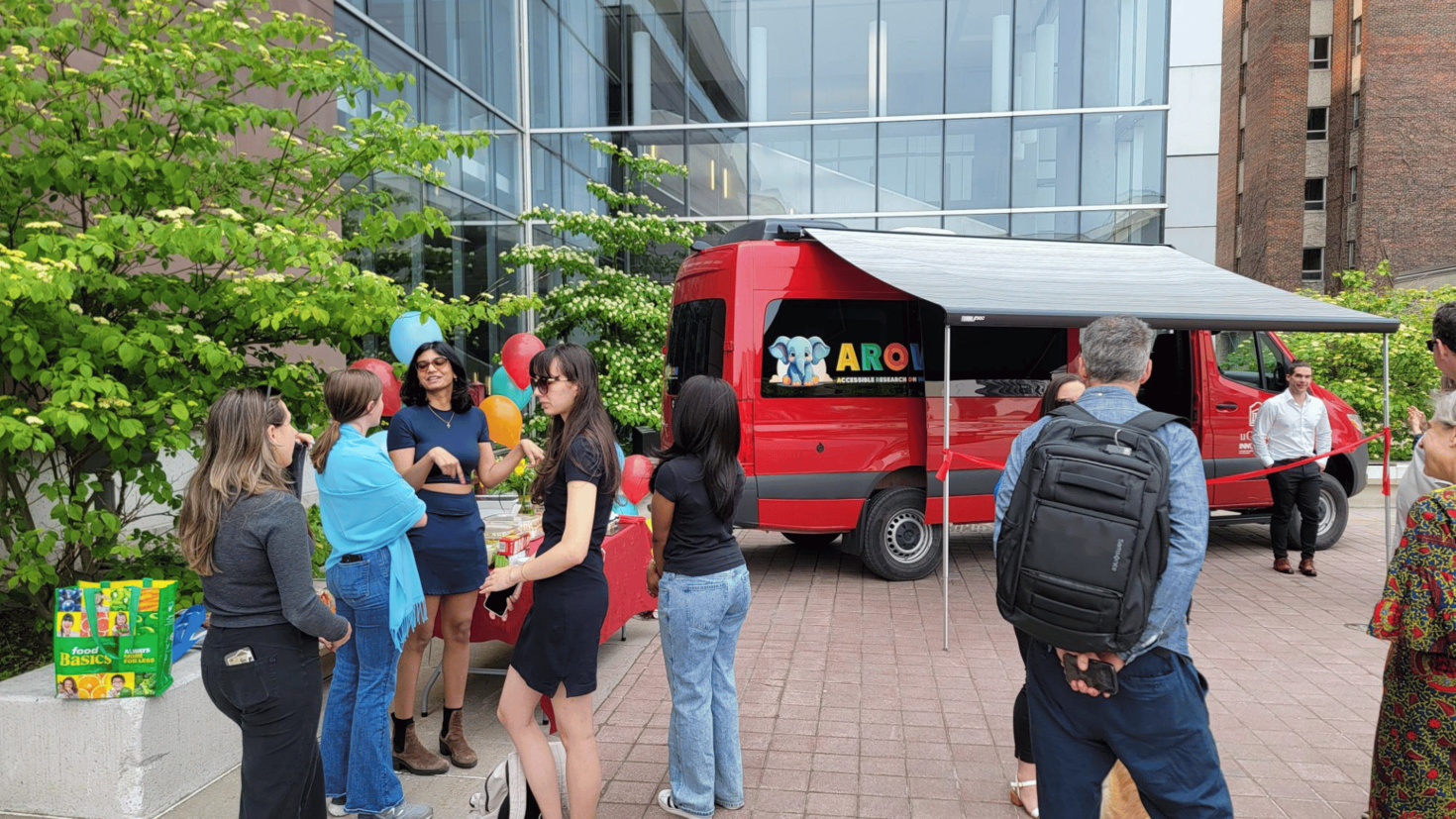 People during the opening of the van