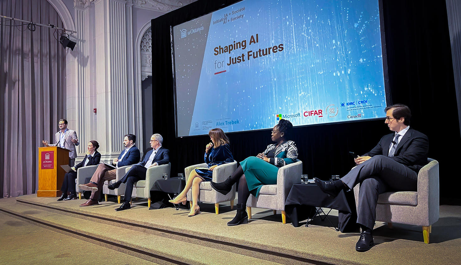 Panelists on stage at the Shaping AI for Just Futures conference.