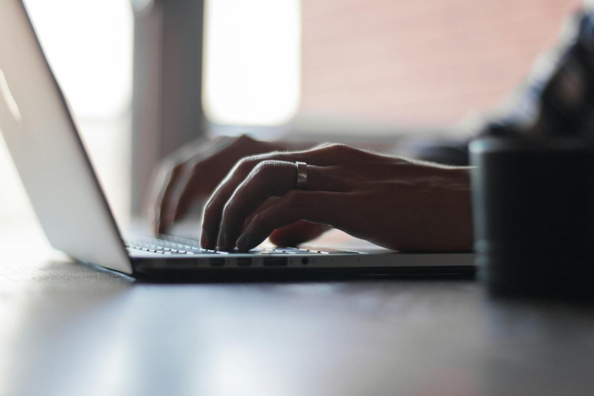 Individual using a laptop
