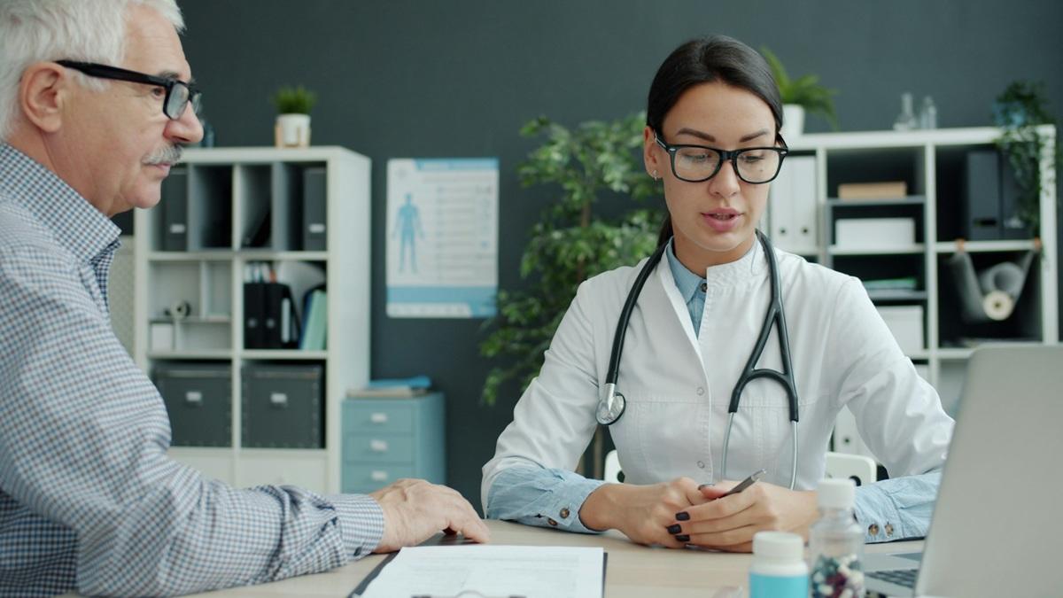 Physician consulting with patient
