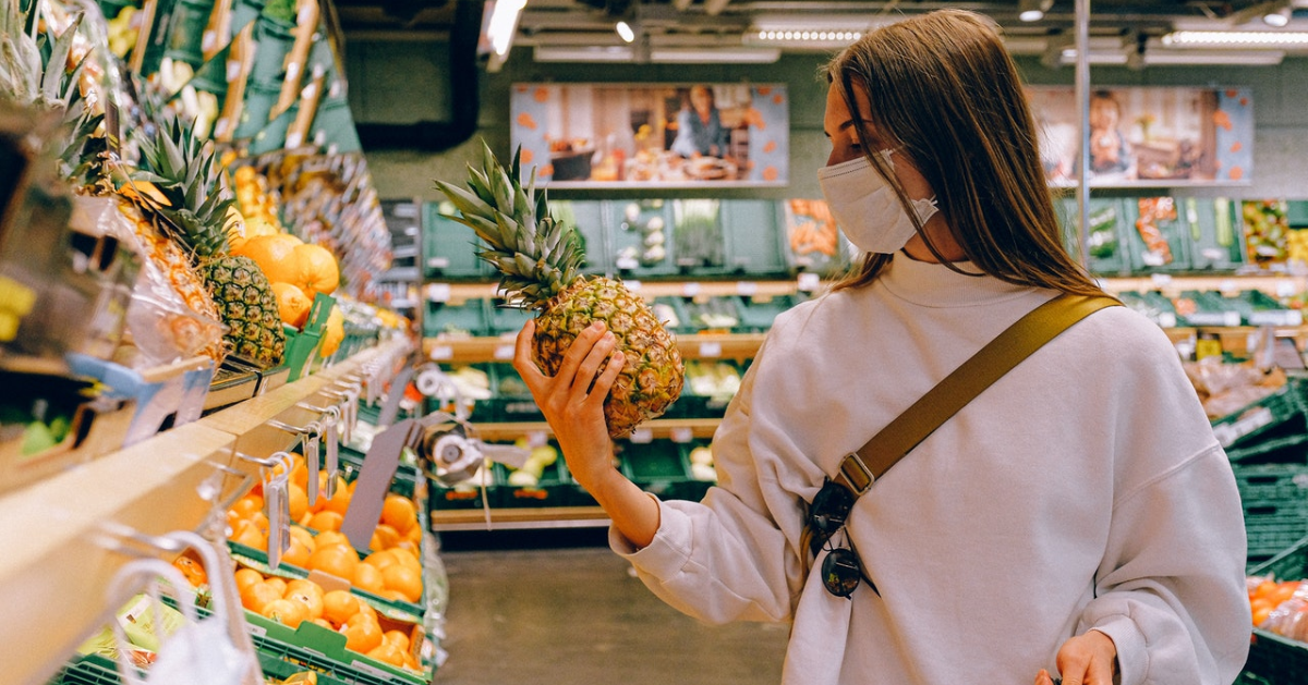 Woman wearing a mask while grocery shopping