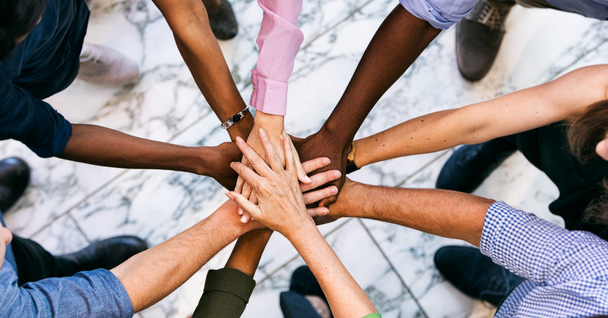 Colleagues from different origins working as a team.