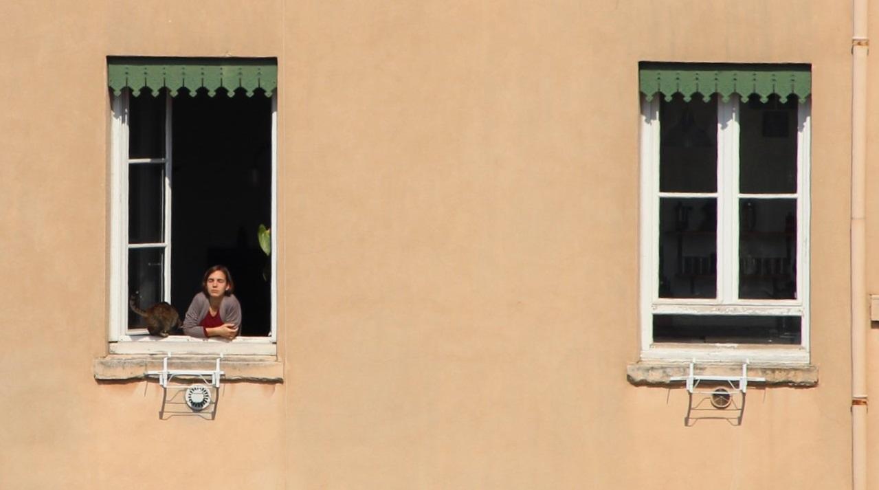 woman looking out window