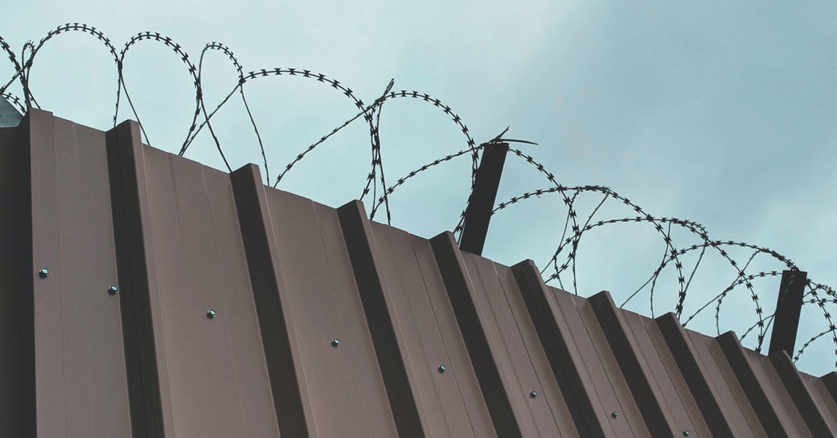 Barbed wire wall