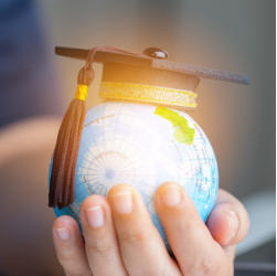 Hand holding globe