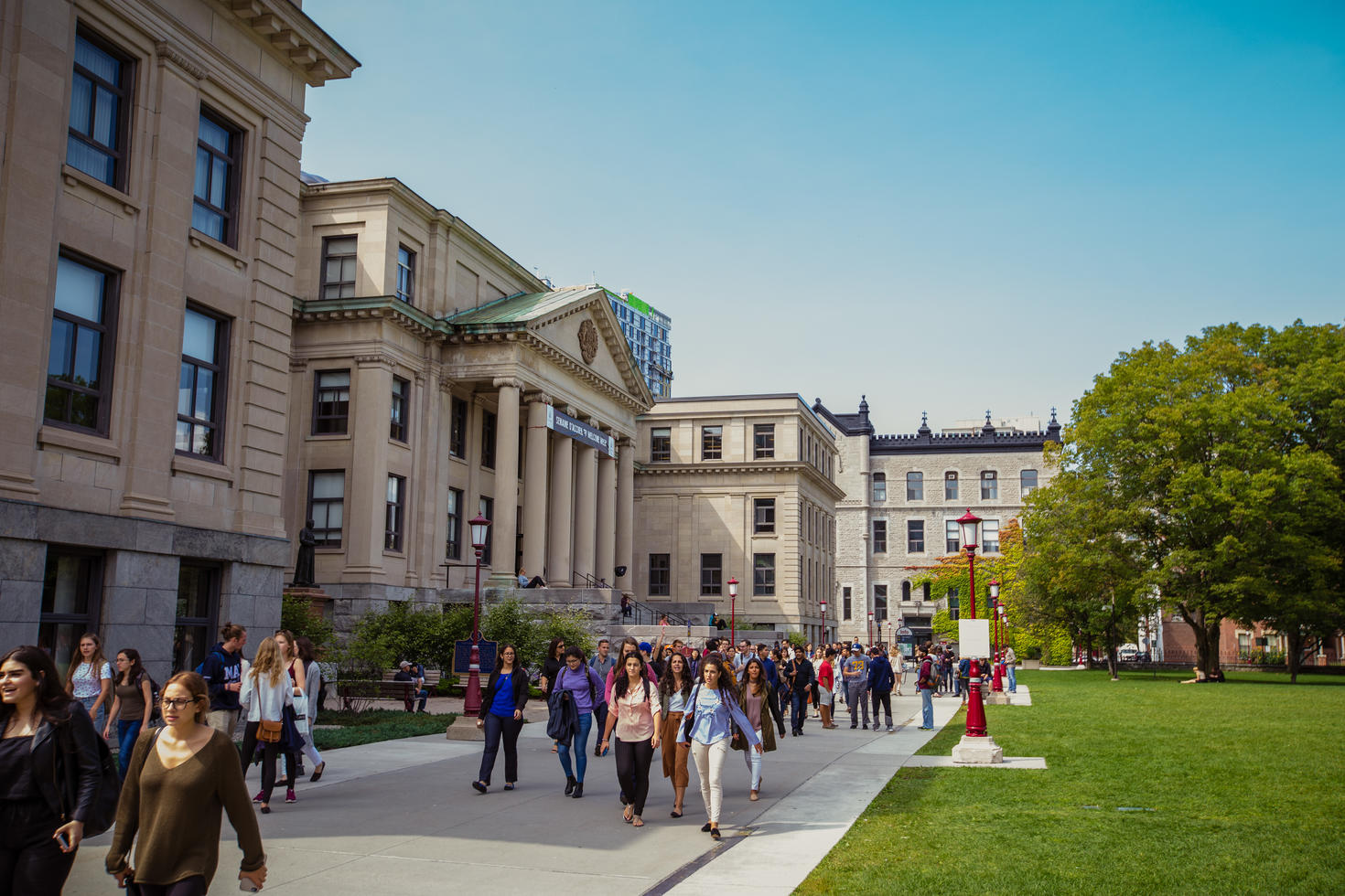 Students walking in front of Tabaret Hall.
