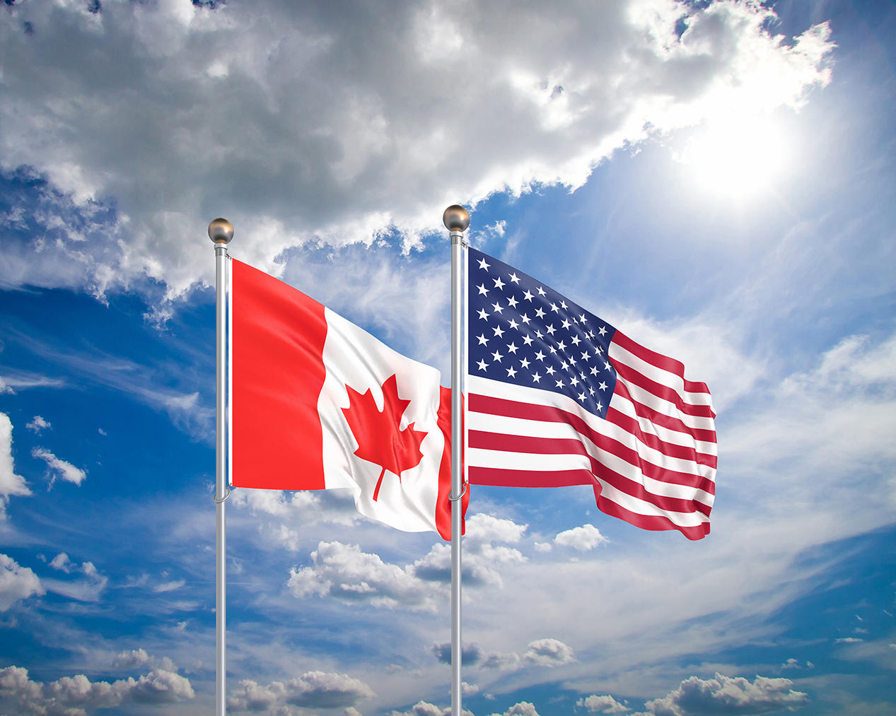 Canada and USA flags in clouds