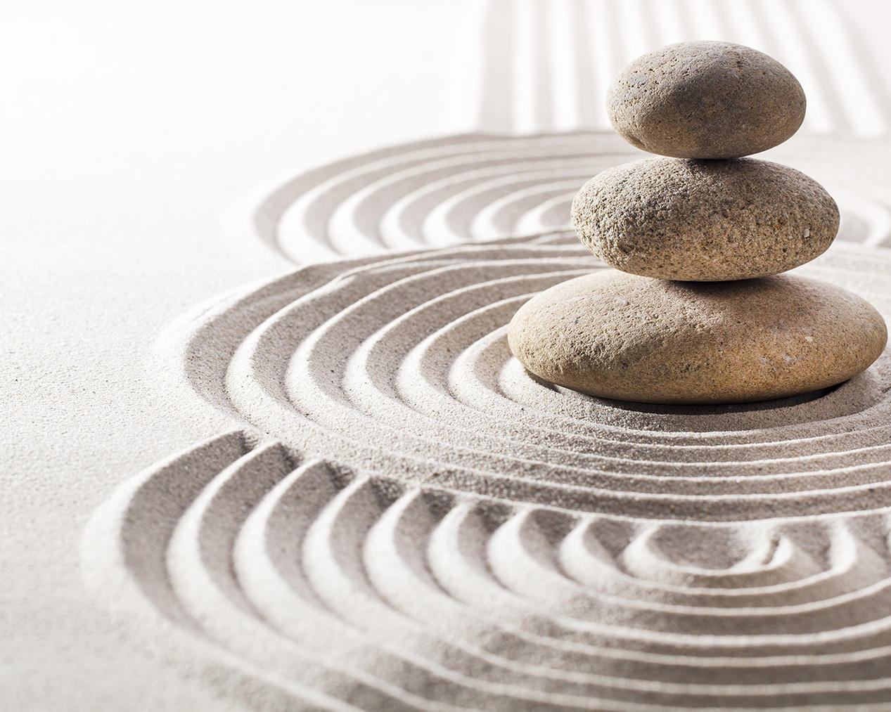 picture of zen stones in sand