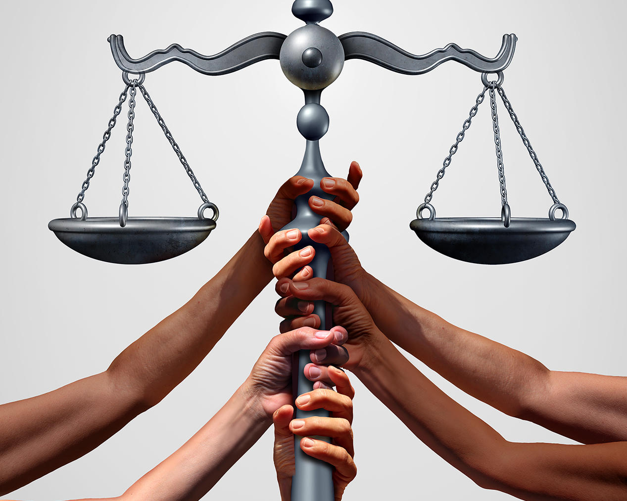 Multicolored hands holding a scale