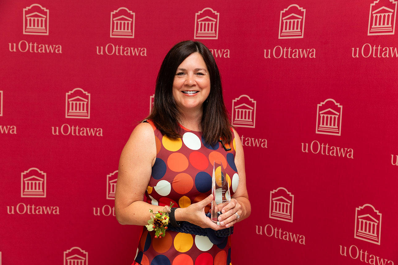 Michelle O'Bonsawin with her award