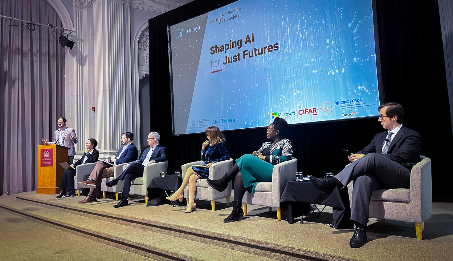 Academics from around the globe discussing AI legislation in a panel