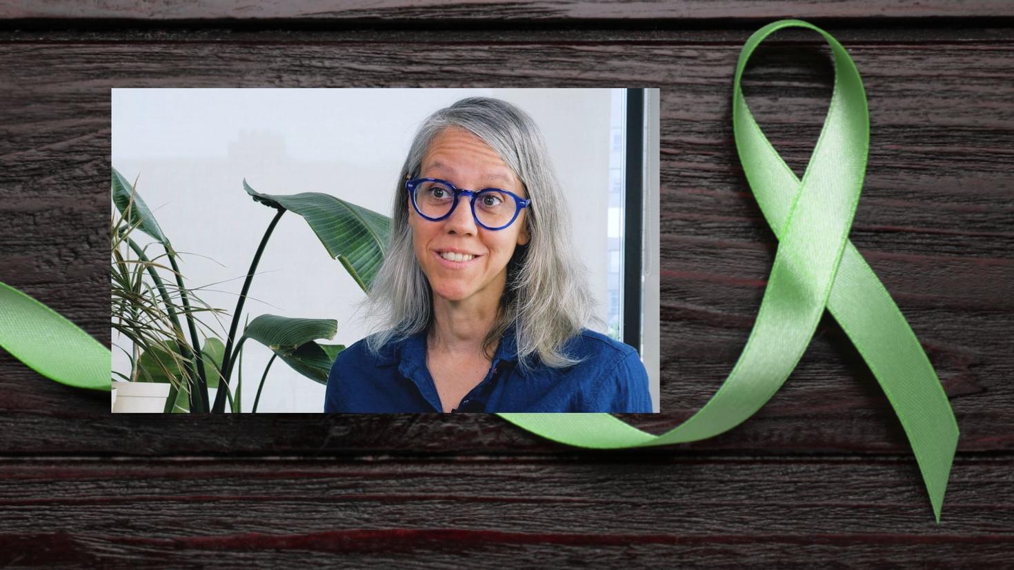Professor Lynda Collins and a green ribbon representing mental health awareness