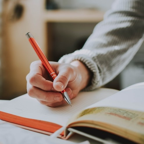 hand holding a pen