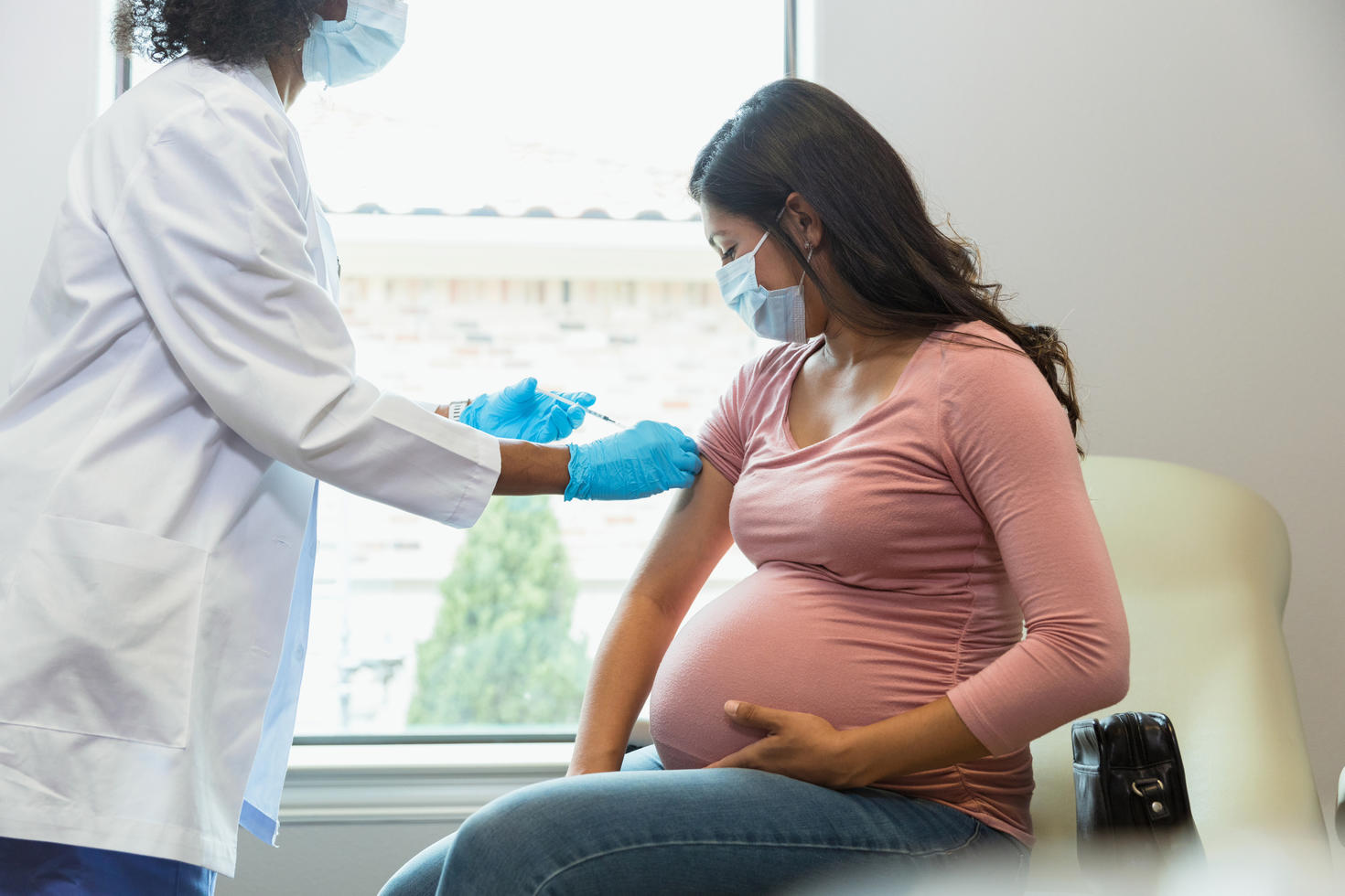 Pregnant woman getting vaccinated