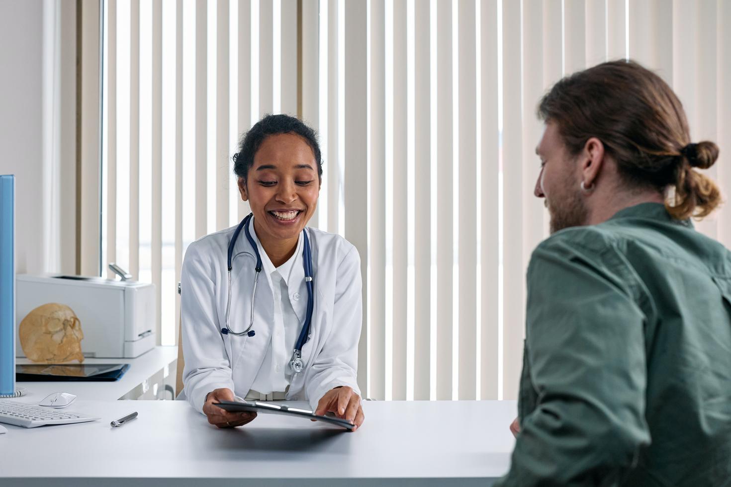Physician talking to her patient
