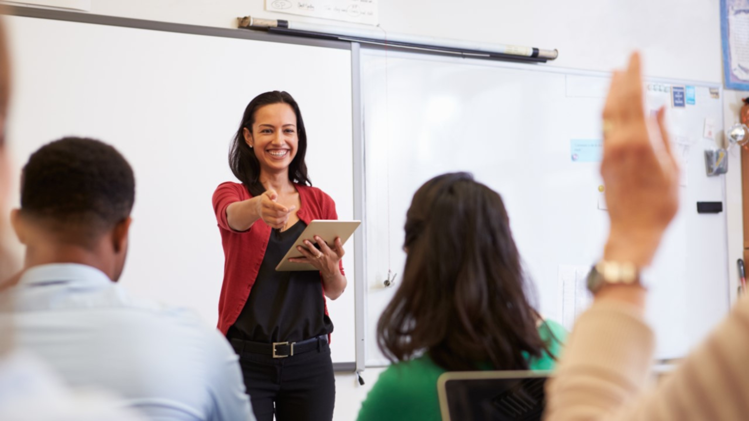 French Teacher in front of a classroom.