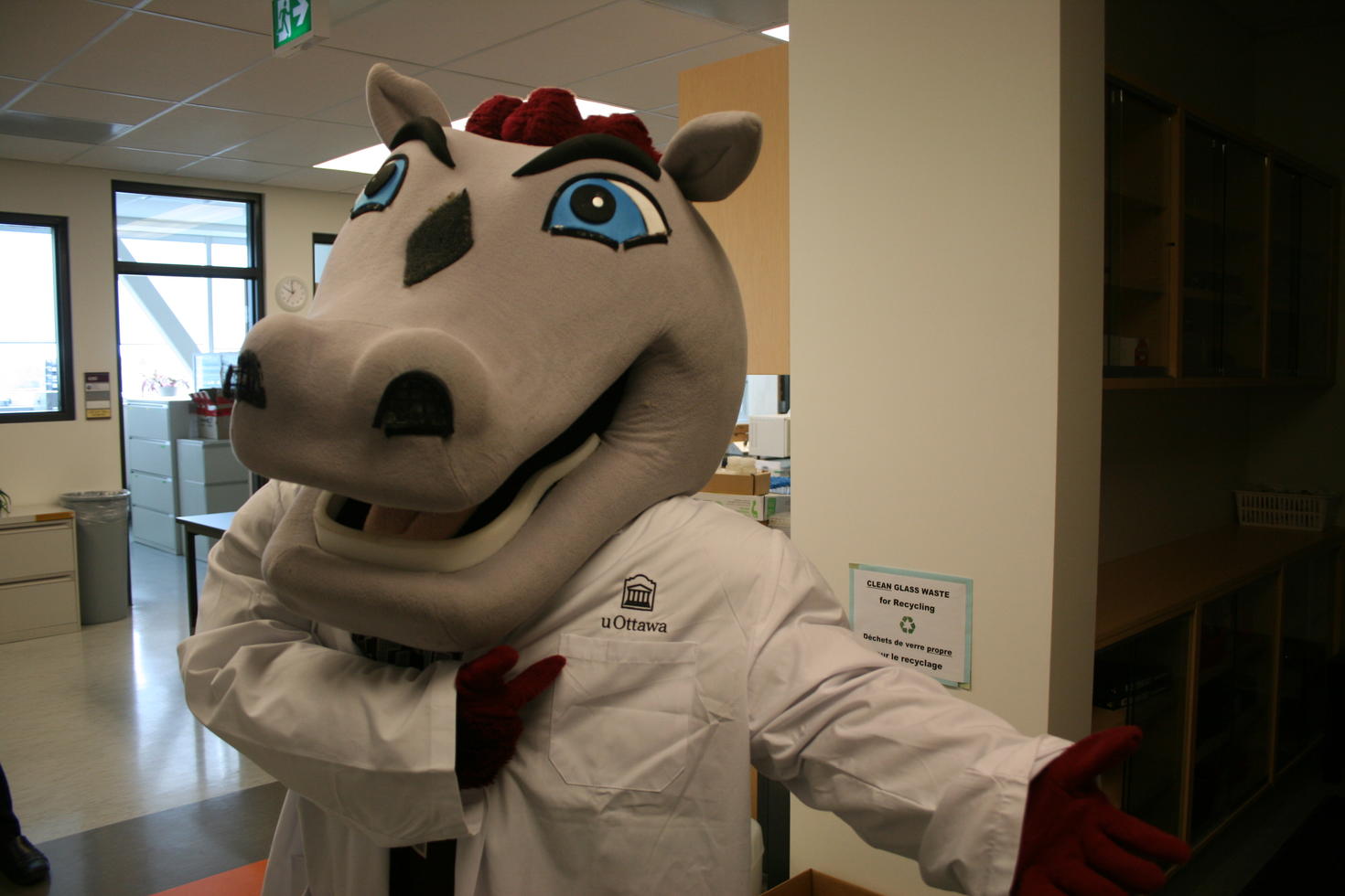 GGEE mascot wearing a lab jacket