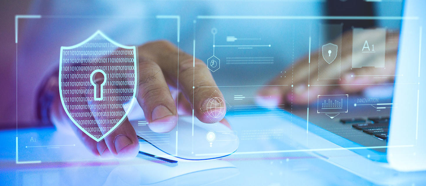 Ordinateur avec un icône de sécurité en superposition.