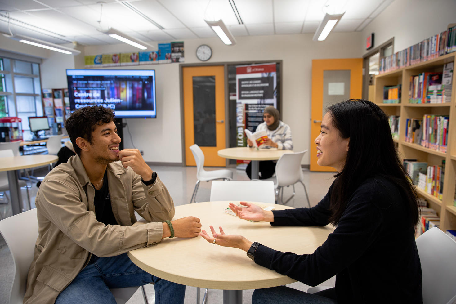 Two students speaking at the Julien Couture Resource Centre.