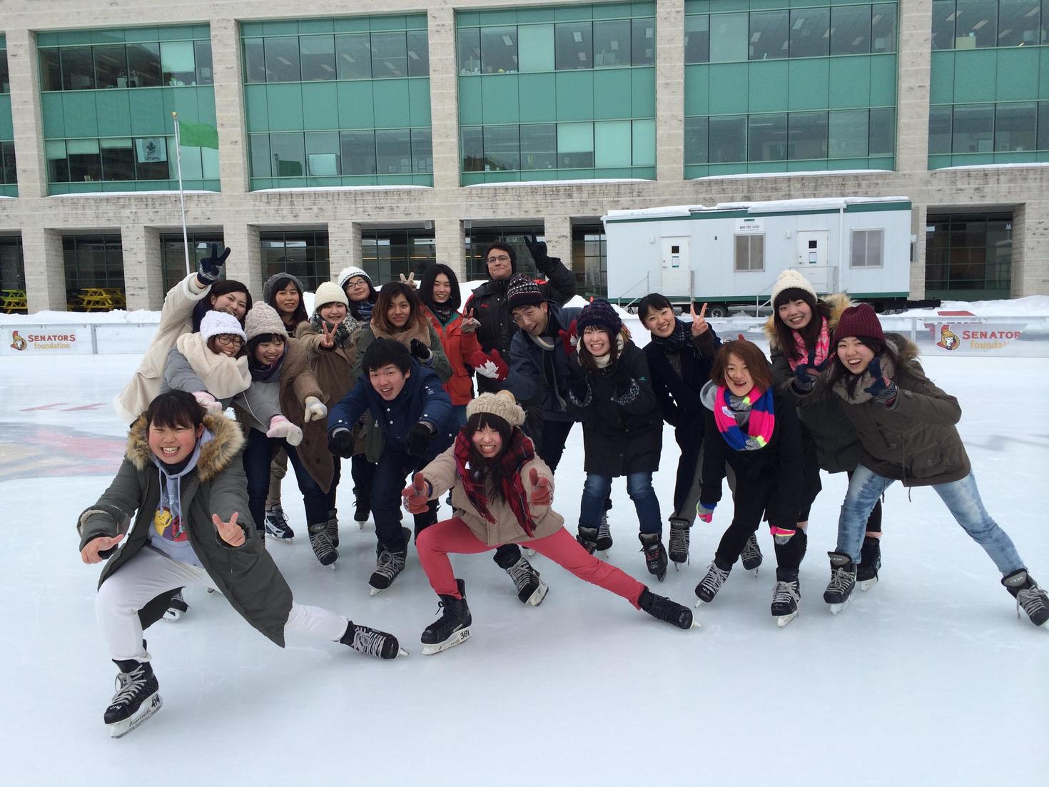 A group of students posing on an ice skating rink