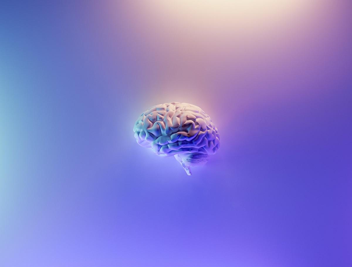 Cerveau flottant sur fond psychédélique
