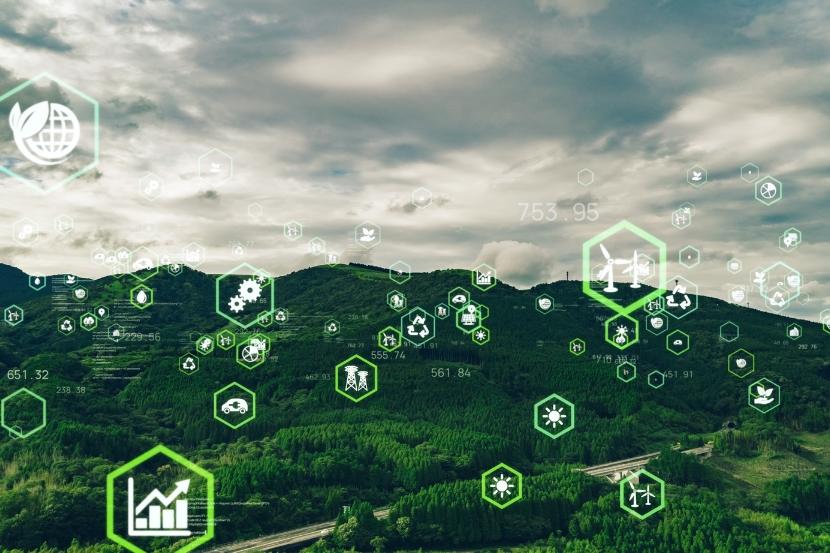 Paysage vert avec superposition d'icônes de durabilité