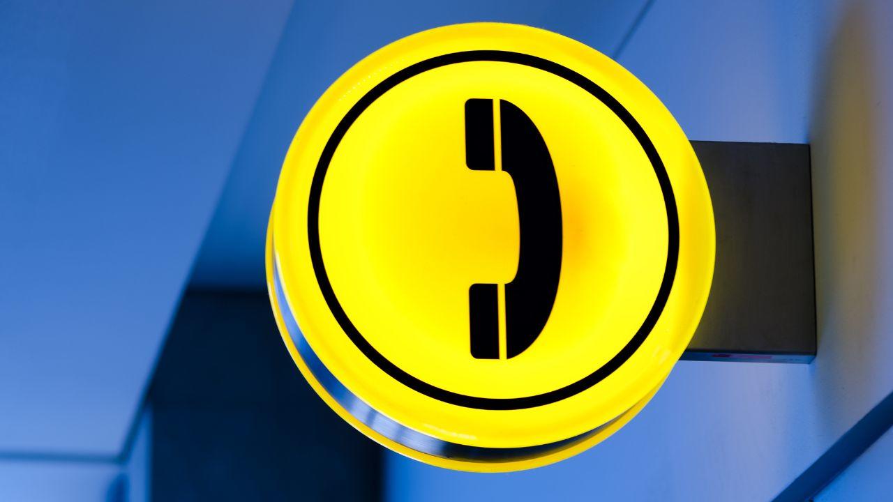 symbole de téléphone sur une enseigne en néon 