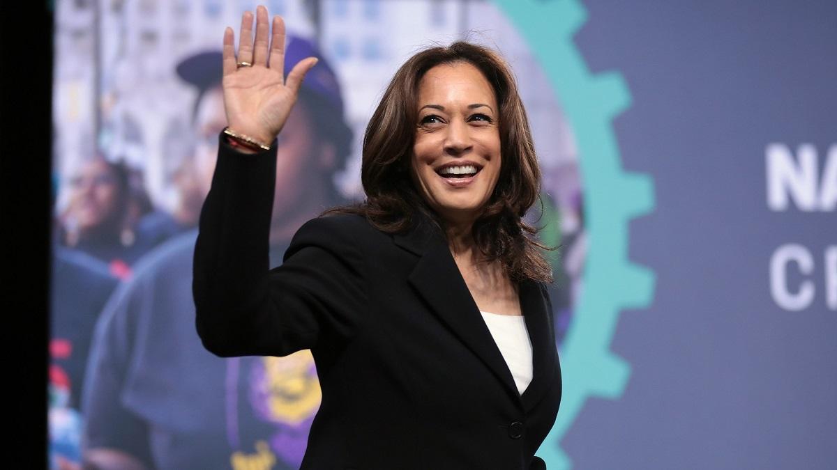 Kamala Harris waving right hand