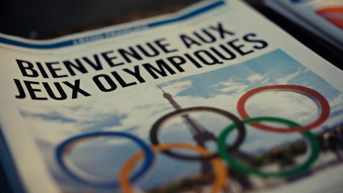 Première page d'un journal avec la Tour Eiffel, les anneaux olympiques