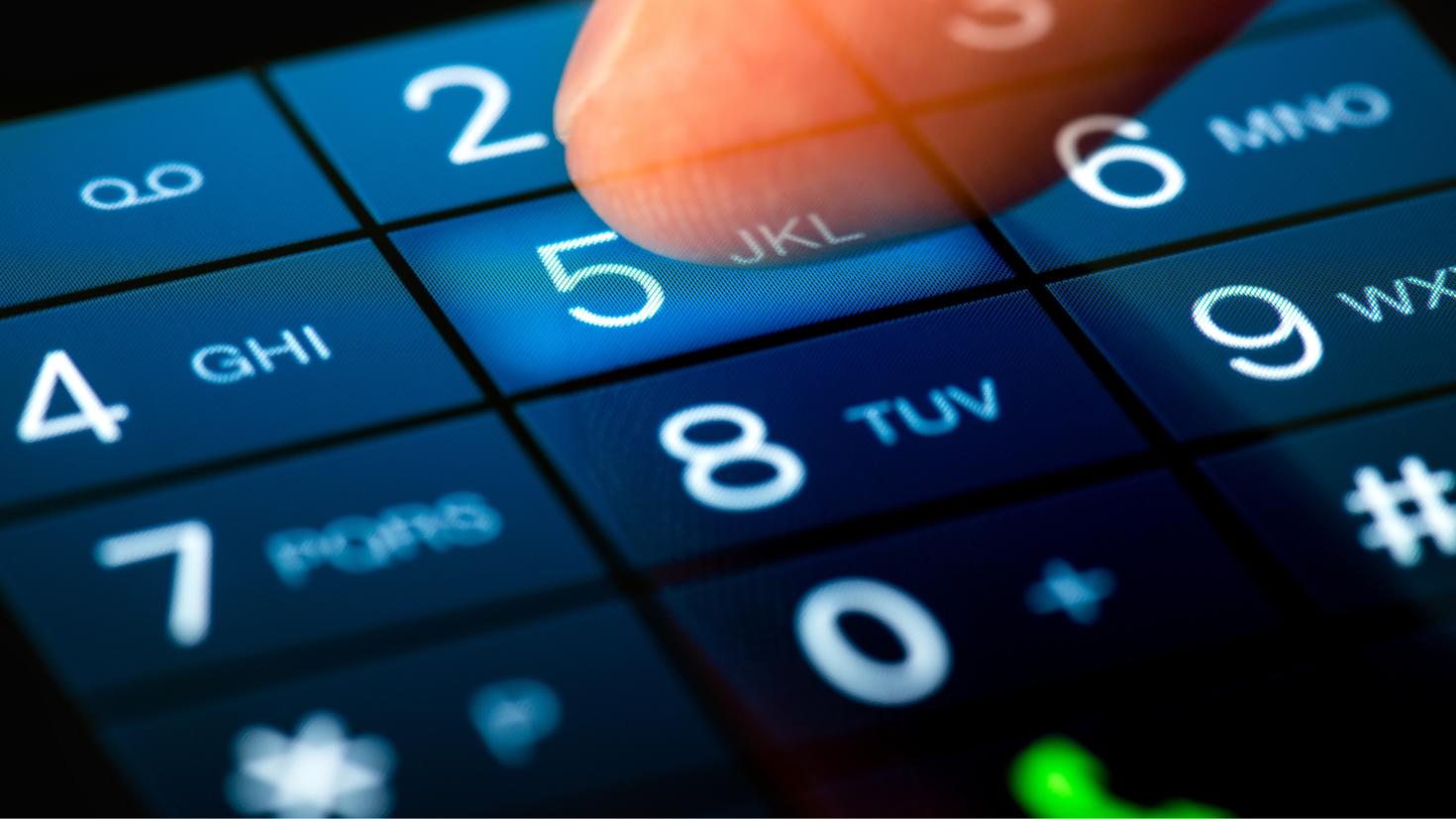 person dialing number 5