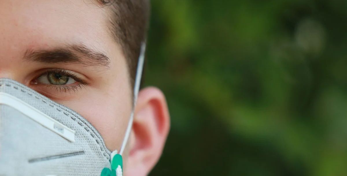 Man wearing mask out in nature