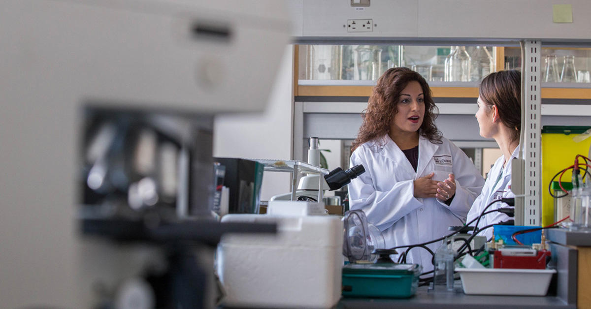 Dr Nafissa Ismail talking with a student in her lab