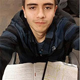 Selfie of brankoomv with textbooks