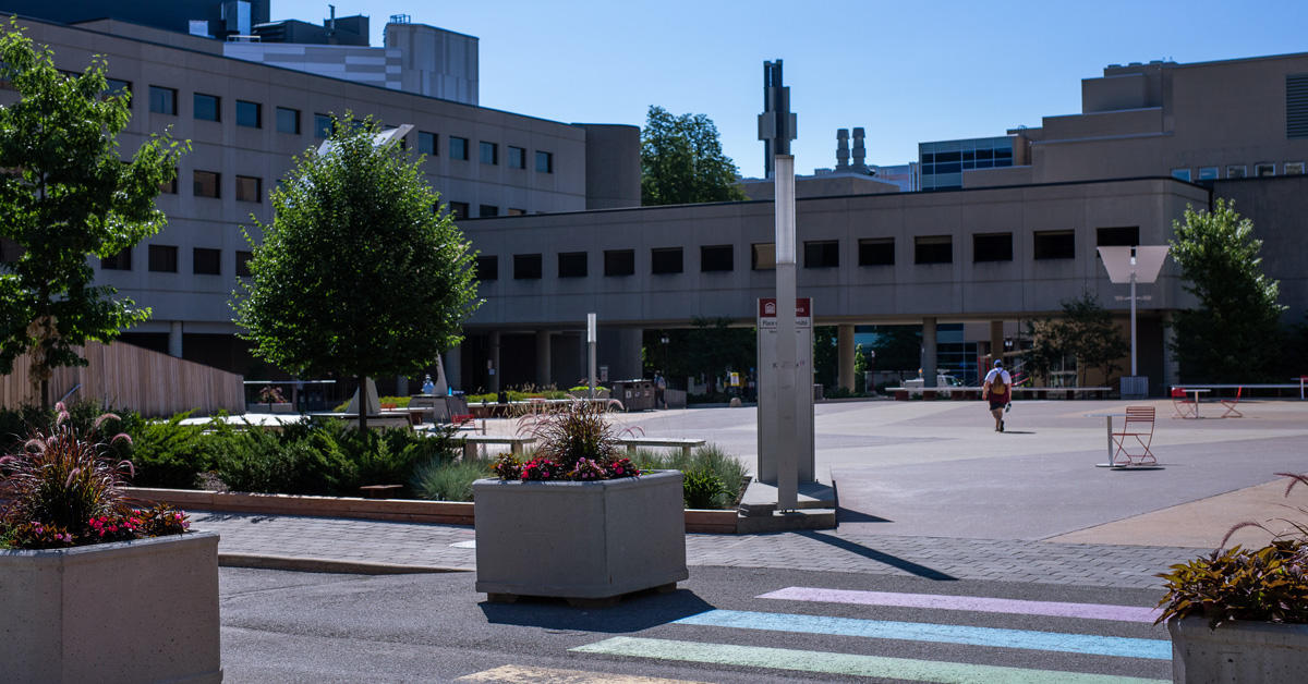 One person walking on campus