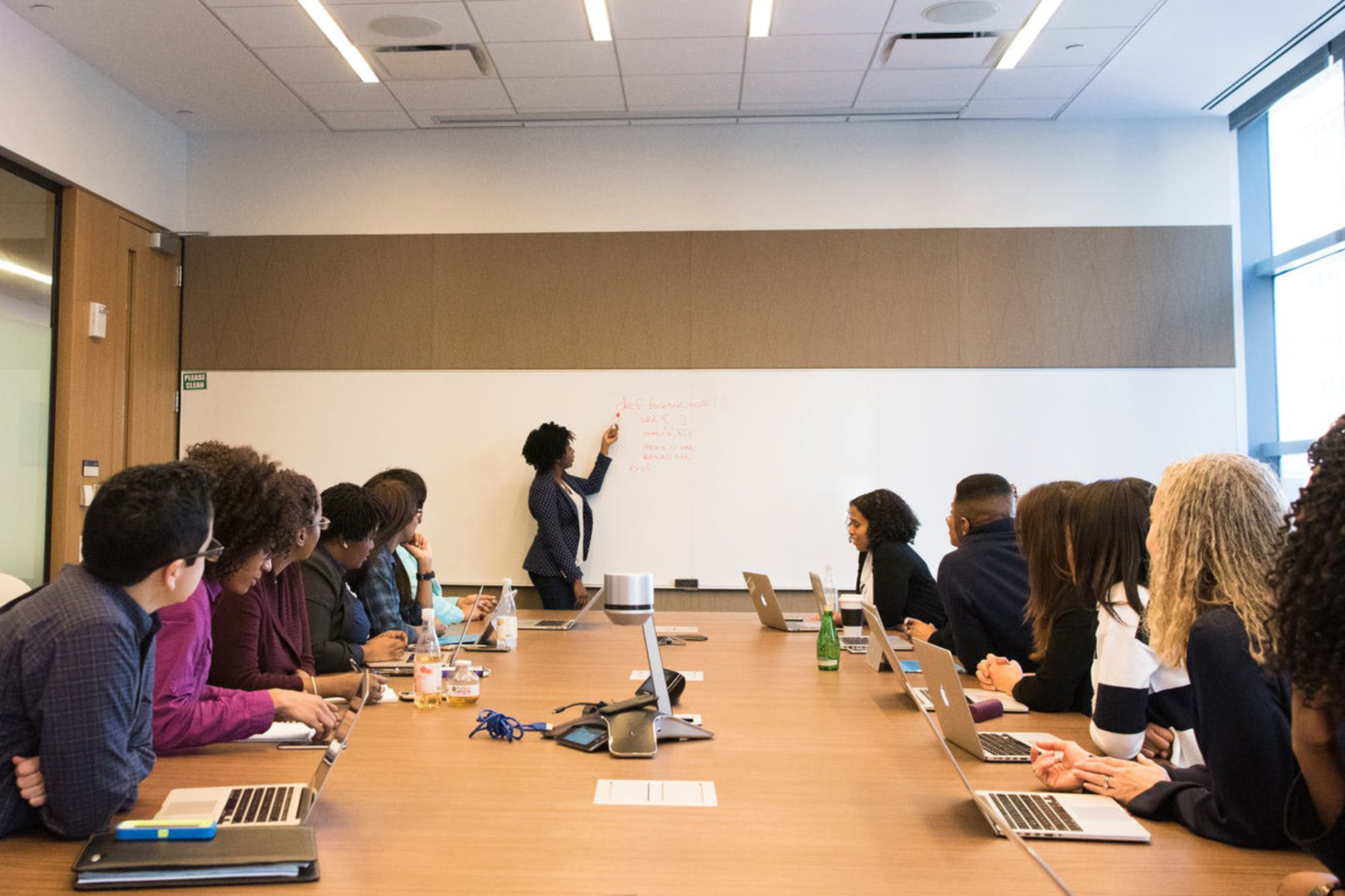 Team members leading a roundtable discussion