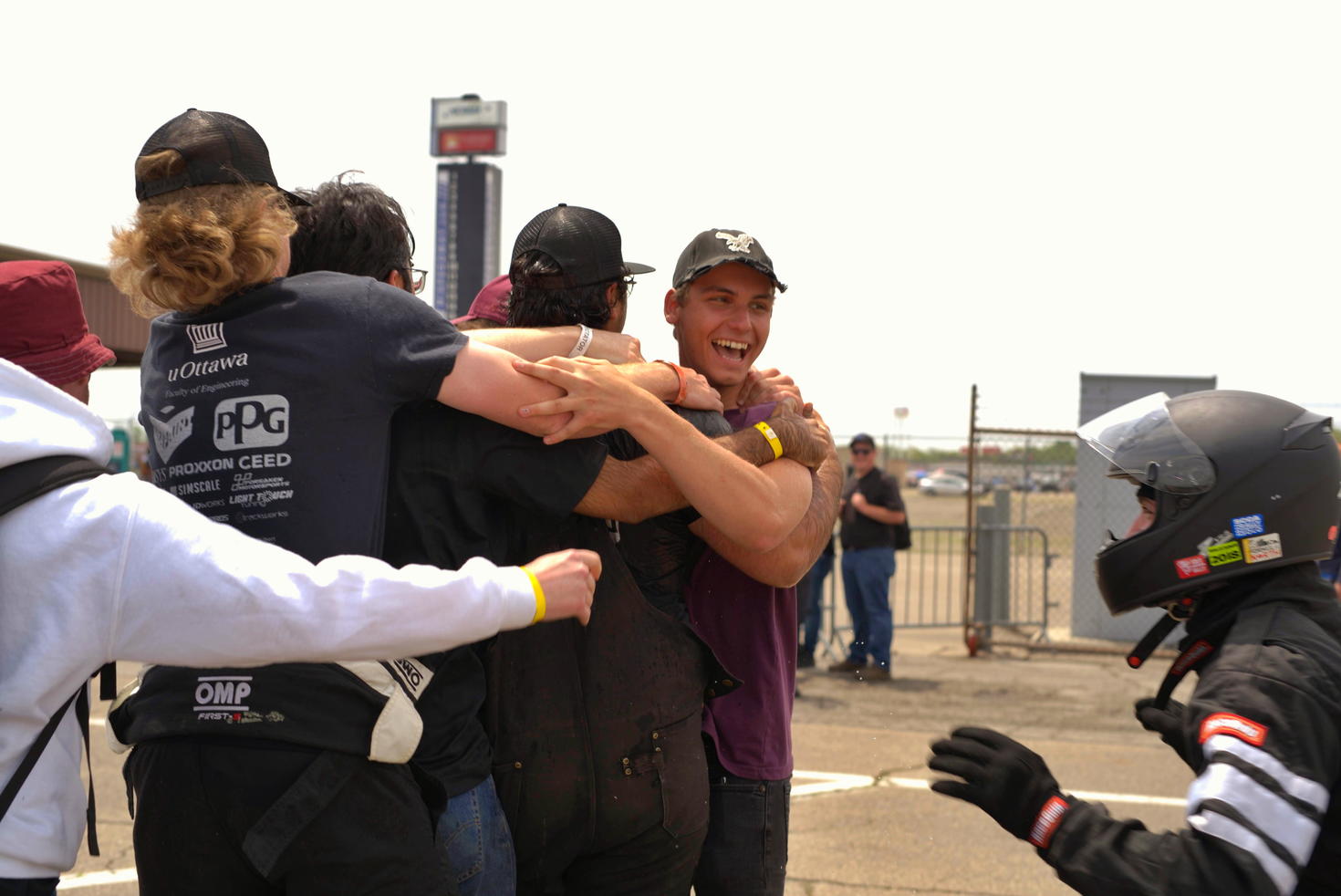 Happy Formula uOttawa team members congratulate each other.