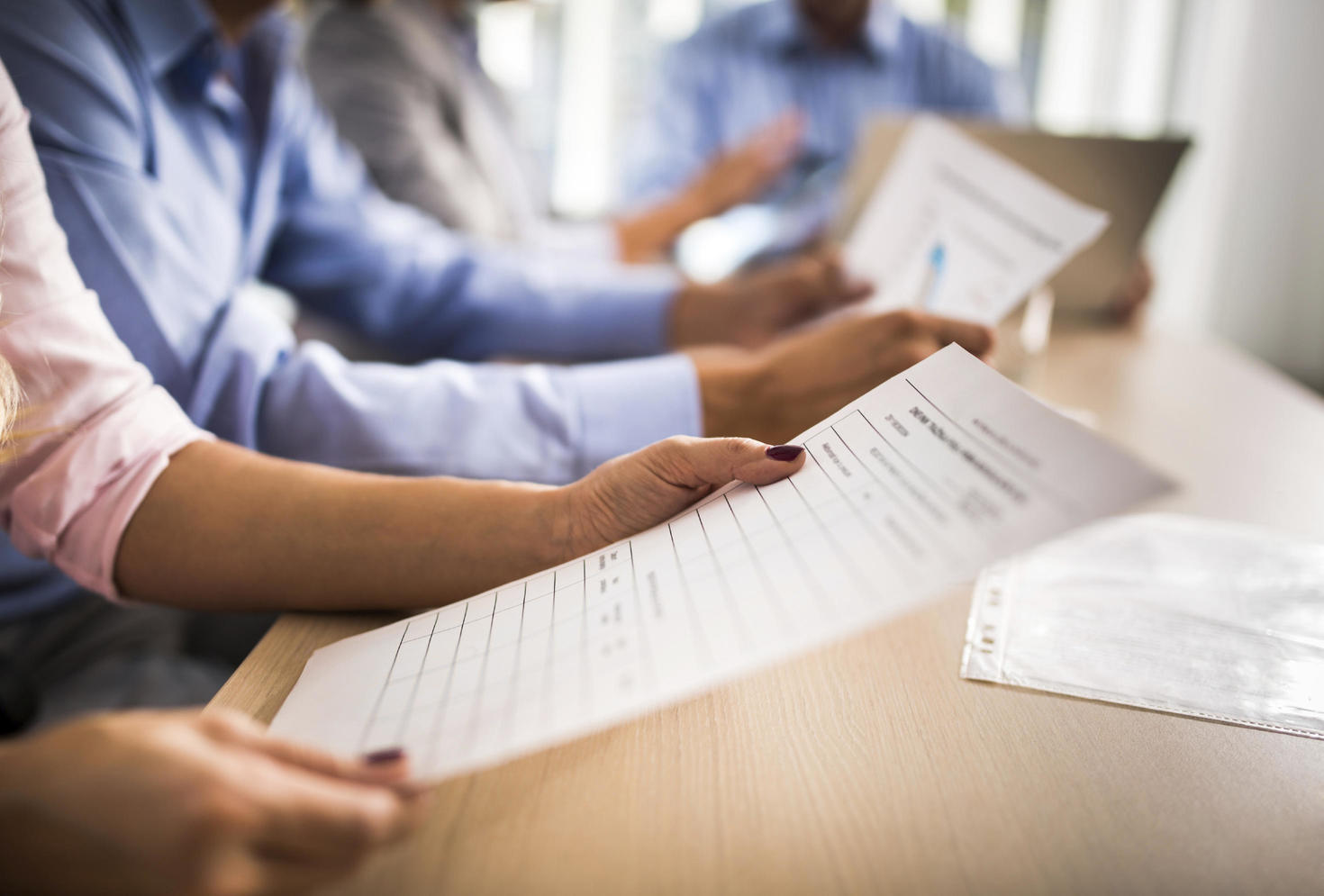 People looking at papers