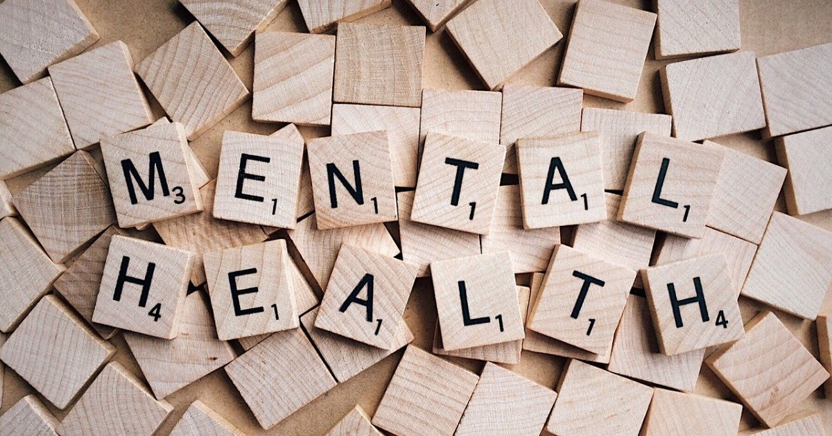 Scrabble pieces spelling out 'mental health'
