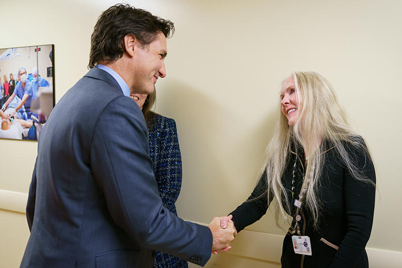 Prime Minister Justin Trudeau shakes the hand of Dr. Melissa Forgie.