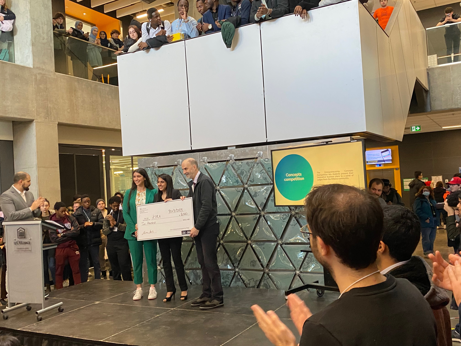 Third place winner receiving cheque