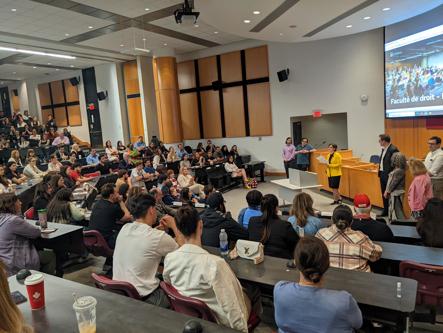 dean speaking to room full of student
