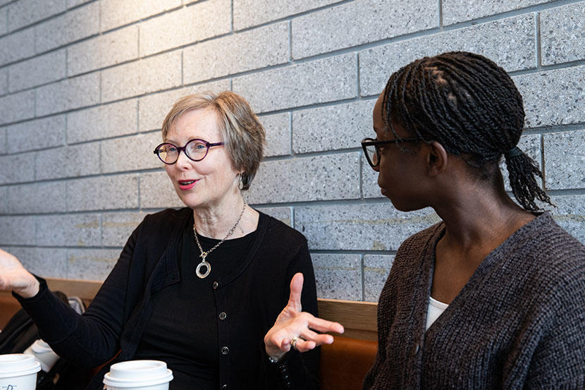 Lily Omakor listening to Marlene Patrick speaking with passion.