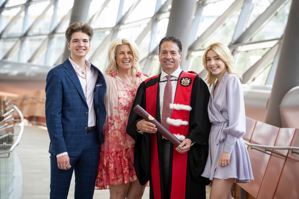 Perry Dellelce with his family after he received his hon doc