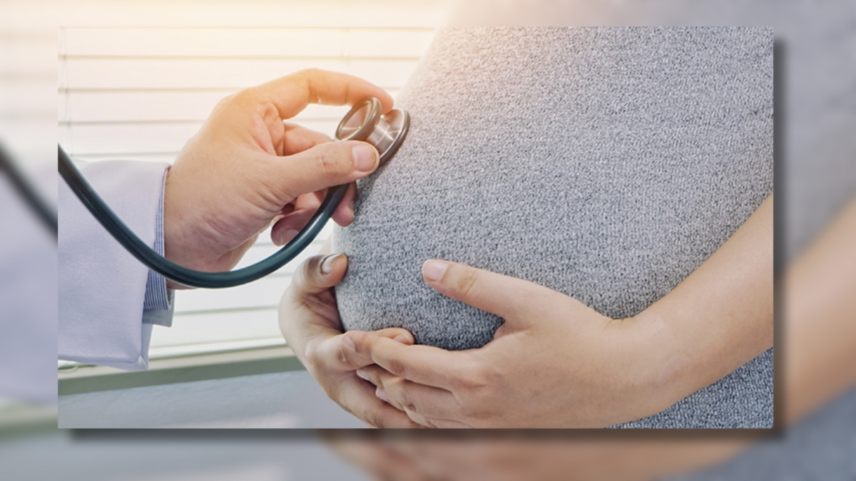 photo of woman's pregnant belly with stethoscope