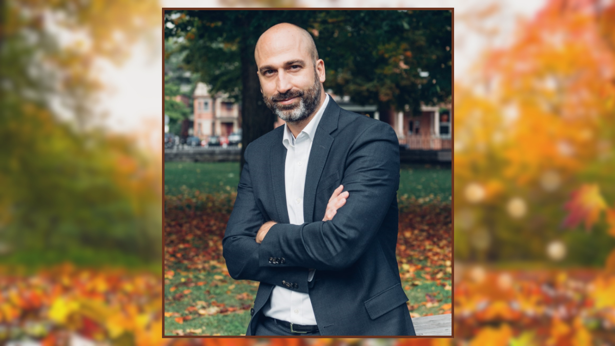 Professor Yan Campagnolo, outdoors, fall leaves on the ground