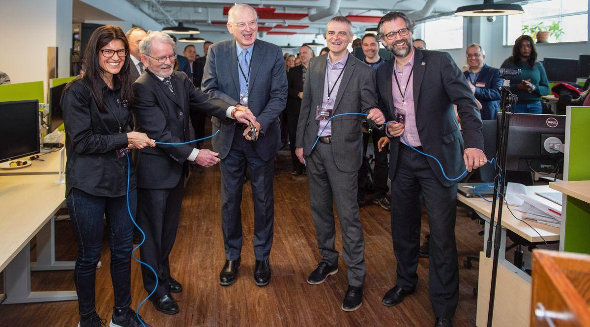 Jacques Frémont with IT staff at the inauguration of the new workspace.