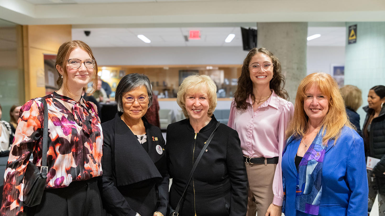 Rt. Hon. Kim Campbell with Talia Chung, Chief Librarian at uOttawa and other event attendees.
