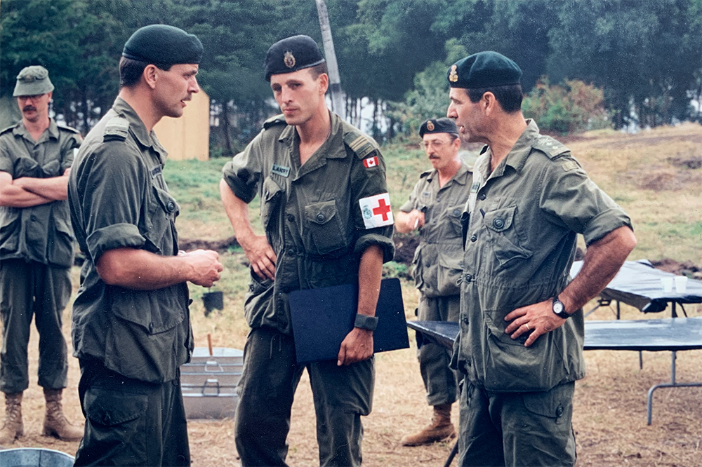 Outside a field hospital in Goma, Congo, Dr. Pierre Morisset stands with other military members.